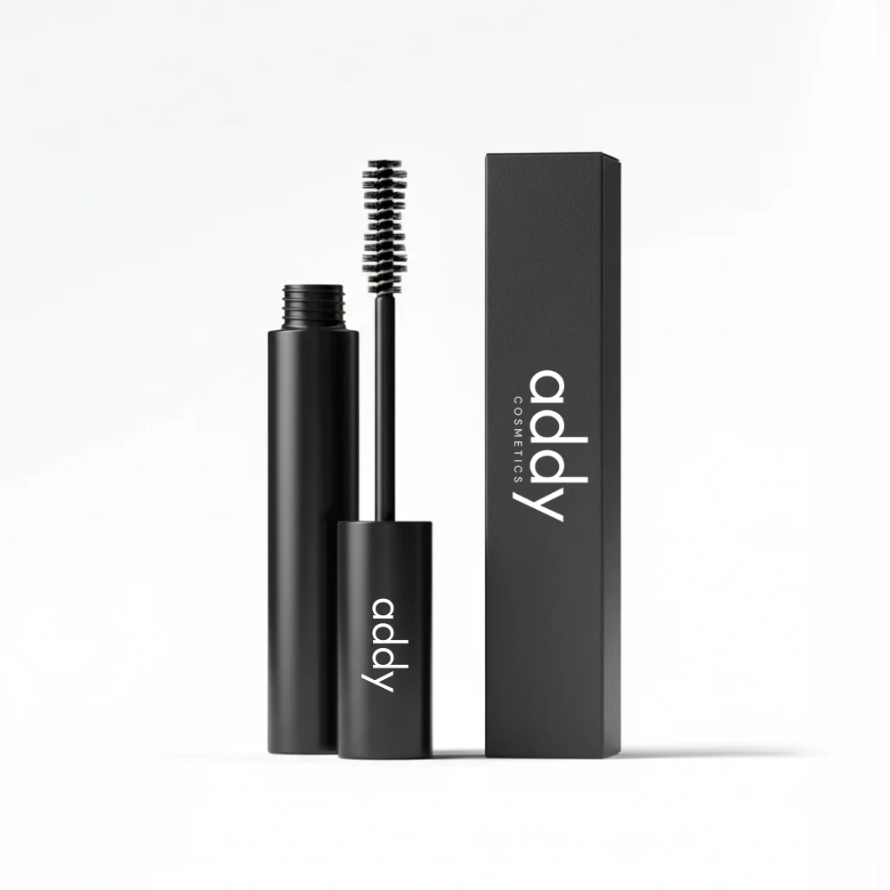 Black mascara with brush and packaging on a white background, featuring the brand 'addy'.