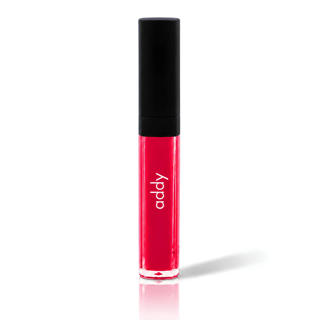 Red lip gloss with black cap on a white background, featuring the brand 'addy'.