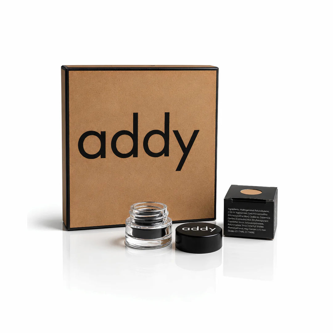 Addy cosmetic products including a jar, box, and compact on a white background
